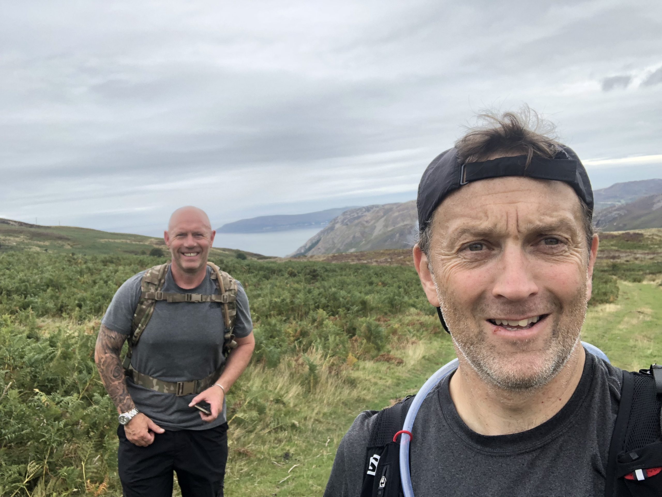 two men on a mountain in Wales