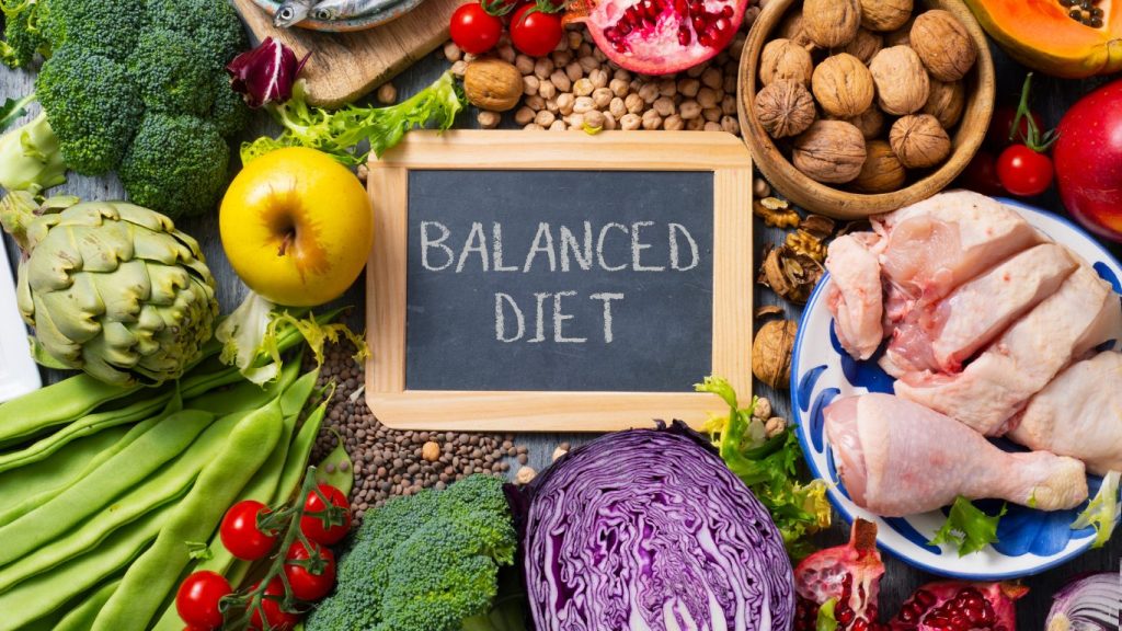 food with sign saying balanced diet.
