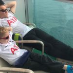 Coop amd me laying back relaxing on a boat