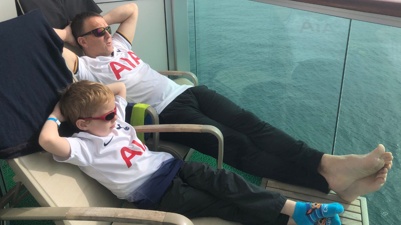 Coop amd me laying back relaxing on a boat