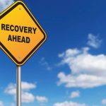 signpost saying Recovery