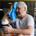 man sitting looking tired