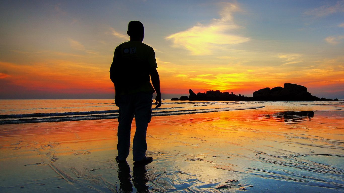 old man looking at the sunset