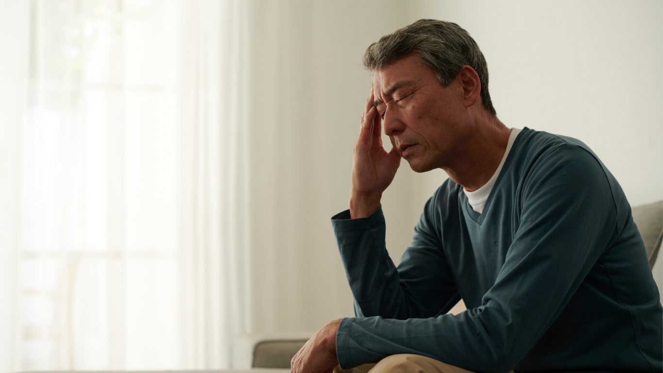 old man looking stressed