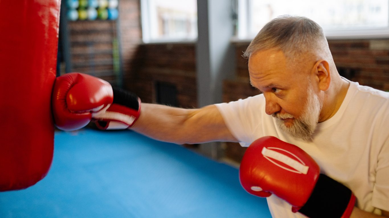 man punching a punch bag