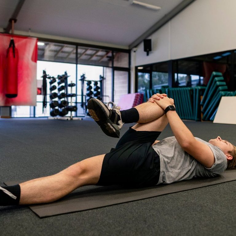 man stretching psoas