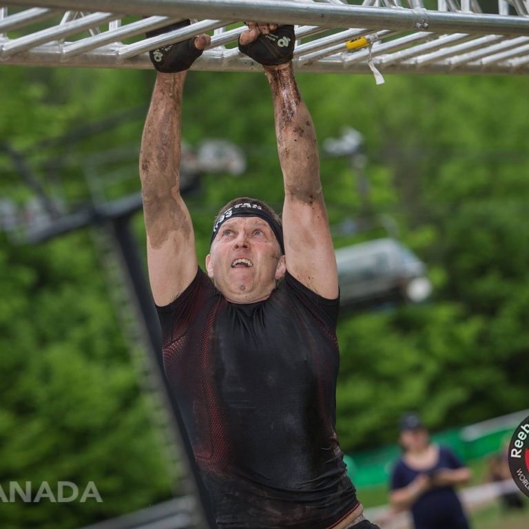man on monkey bars