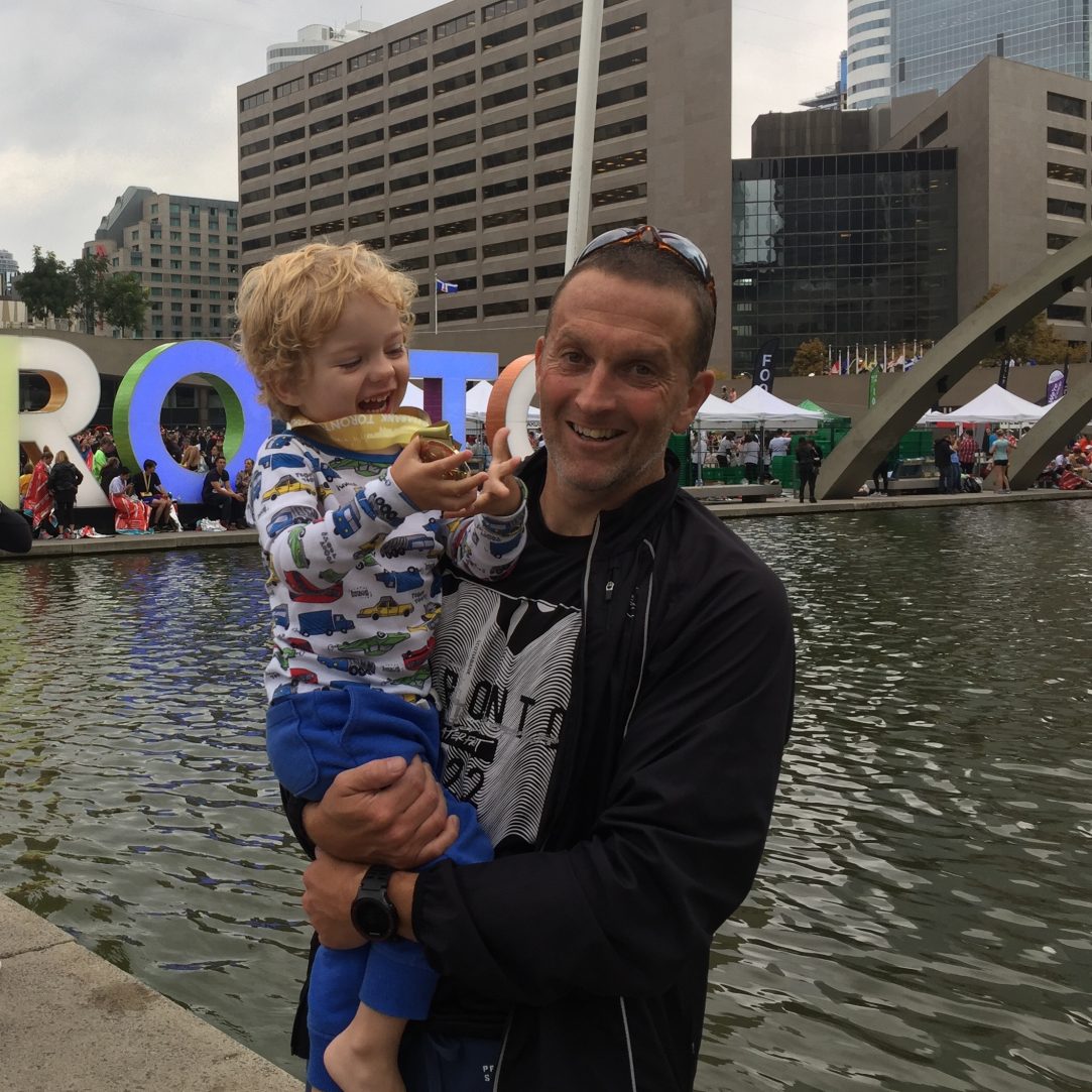 Standing holding Coop in Toronto