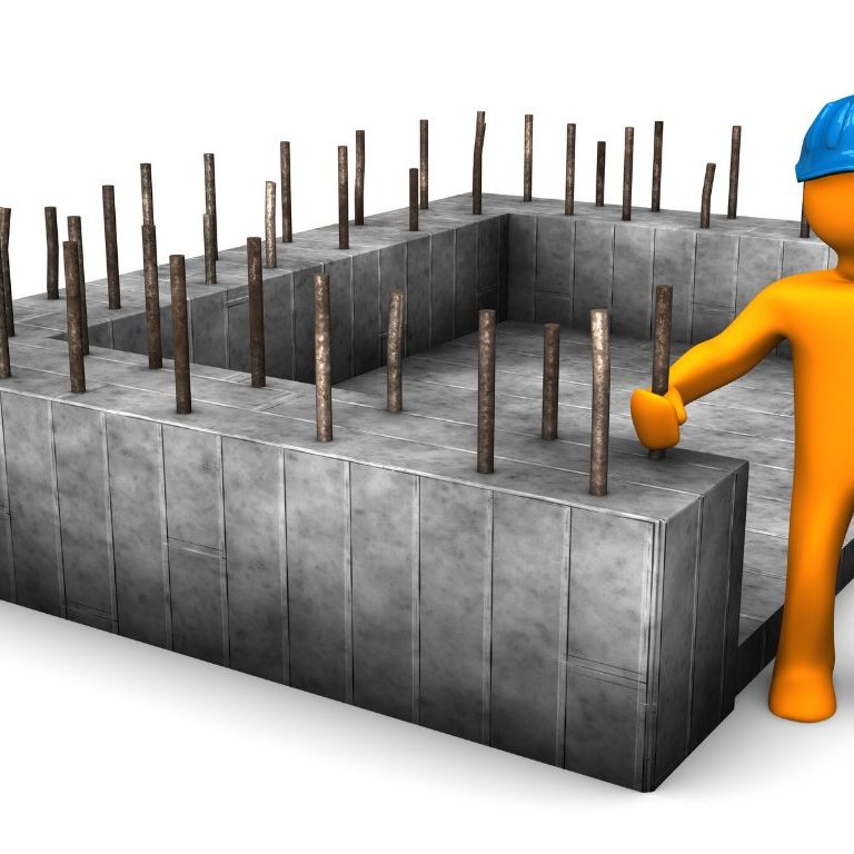 man next to concrete foundations