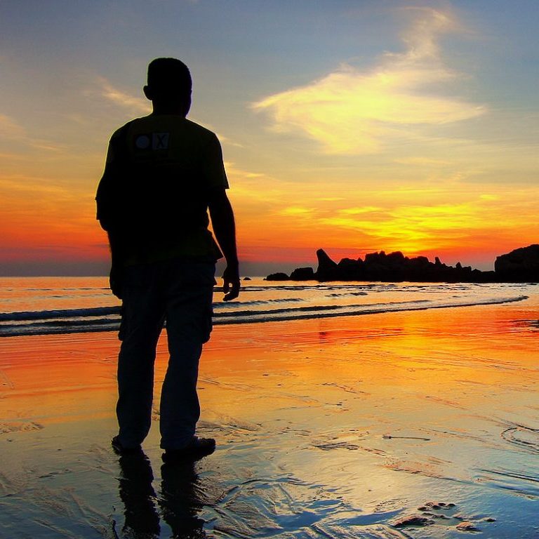 old man looking at the sunset