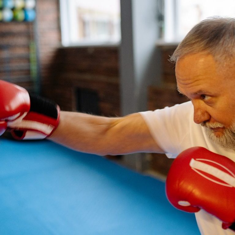 man punching a punch bag